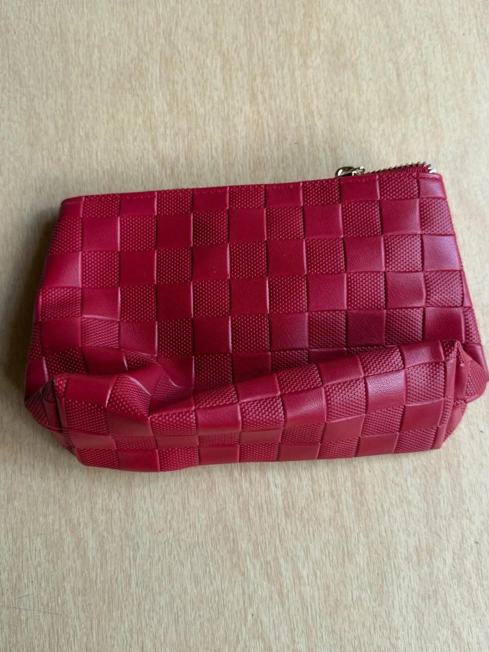 Jo Malone London cosmetic bag features a vibrant red woven design